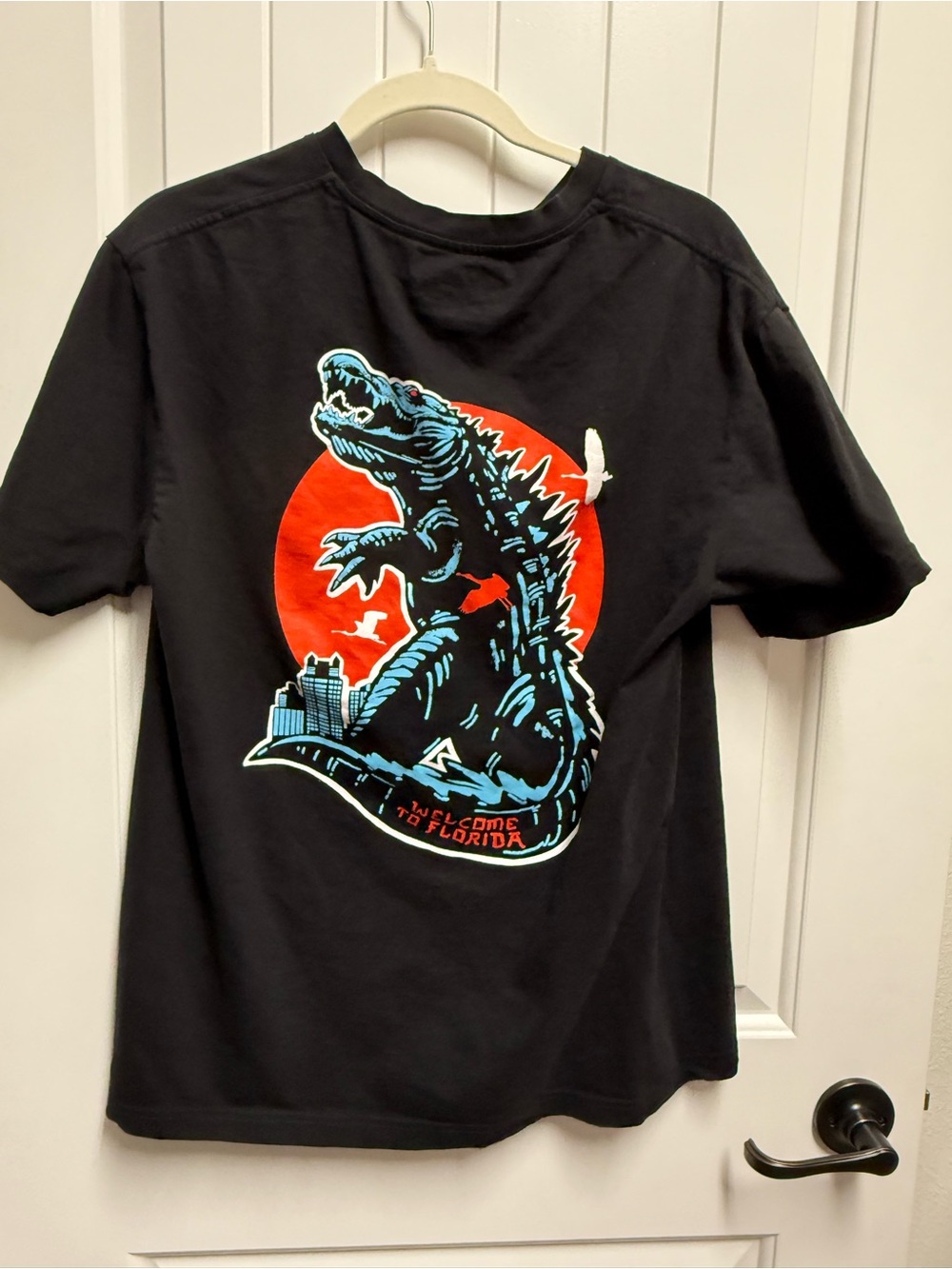 Black Graphic Tee with Blue & Red Godzilla Alligator Design